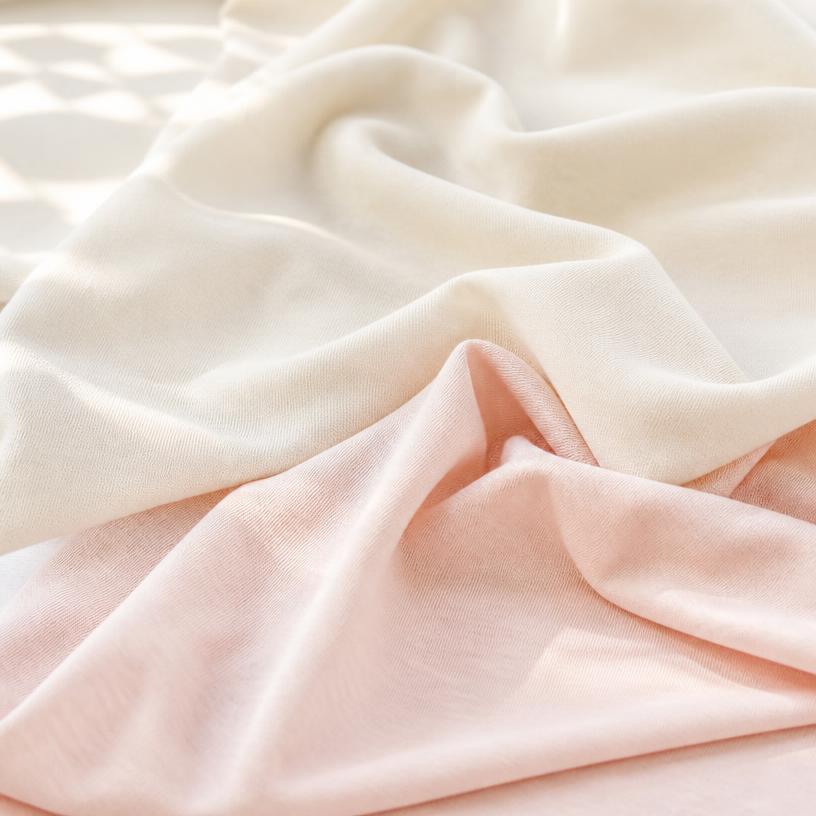 Draped pastel cotton jersey fabric